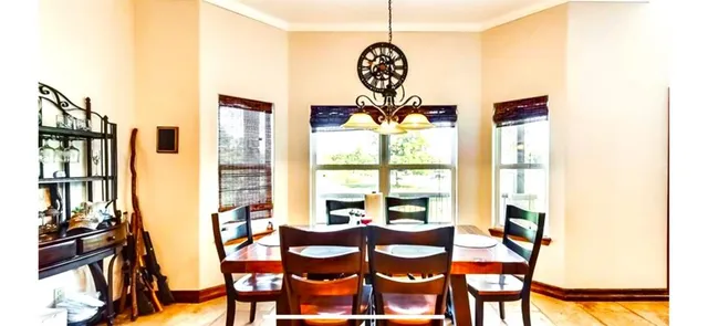 a bedroom with a bed and a mirror on the wall