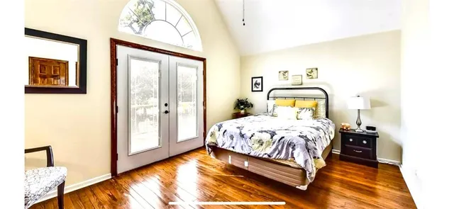 a bathroom with a tub and large window