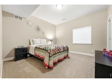 a bedroom with a bed and a cabinets
