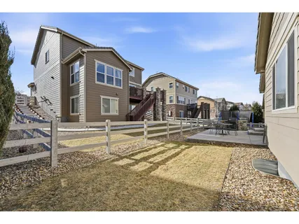 a view of a house with backyard porch and sitting area