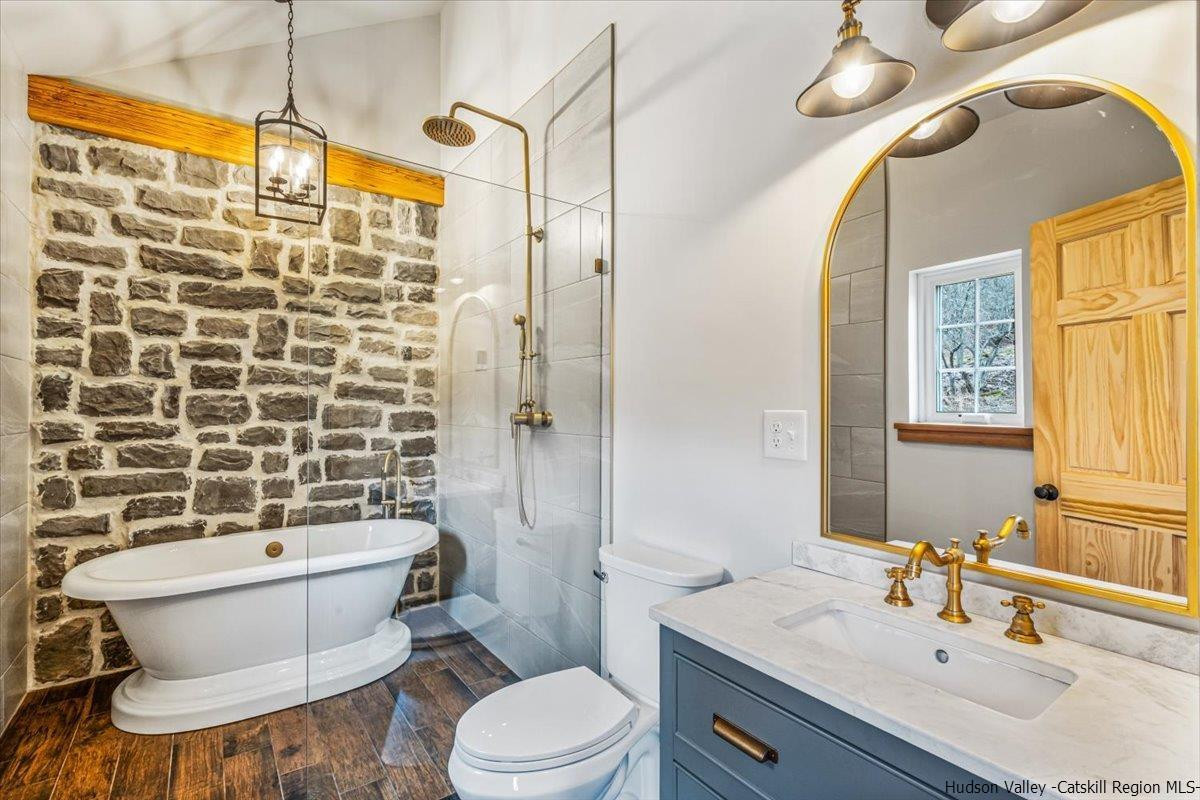 41 Carr George Road Roxbury, NY 12421 - Photo 13 of 26 a bathroom with a sink a toilet a mirror and shower