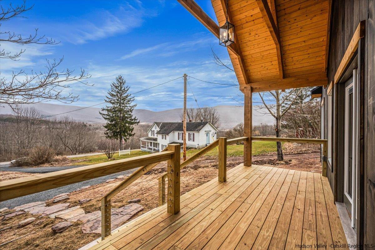 41 Carr George Road Roxbury, NY 12421 - Photo 6 of 26 a view of a balcony with wooden floor and potted plants