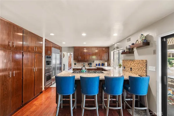 a living room with furniture and a bed