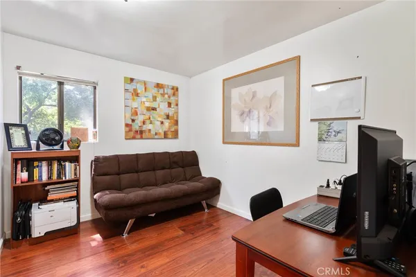 a bed room with furniture and a floor to ceiling window