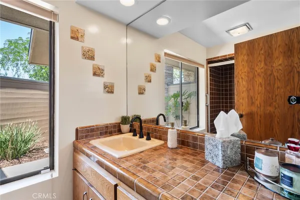 a bed room with a bed and a chair