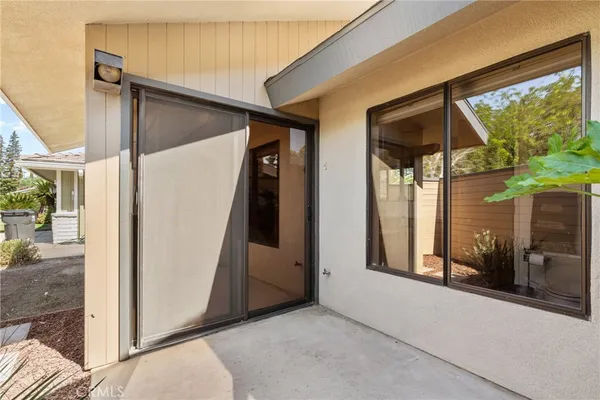a view of walk in closet with clothes