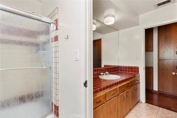 a view of a house with swimming pool and sitting area