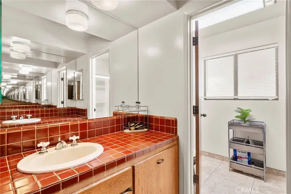 a view of a house with pool and sitting area