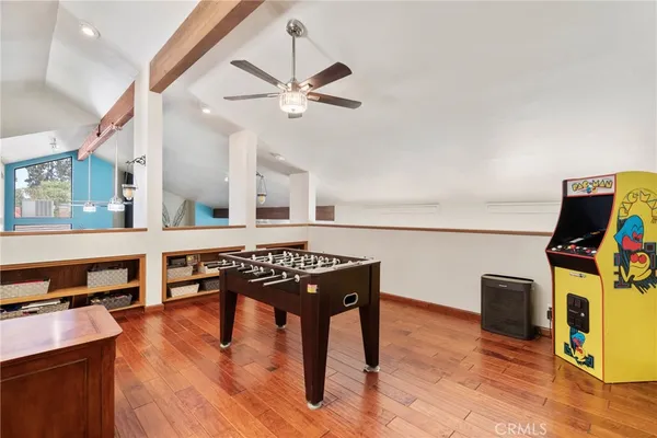 a view of a house with a big yard and a large tree