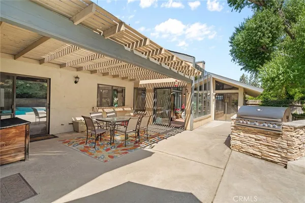 an aerial view of a house with a yard basket ball court and outdoor seating