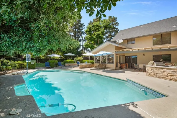 an aerial view of residential building with green space
