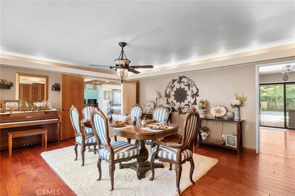 a living room with furniture pool table and a large window