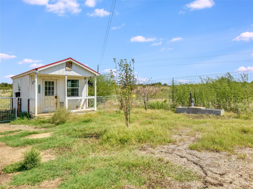 1000 County Road 484 Elgin, TX 78621 - Photo 26 of 30 a view of a house with a yard