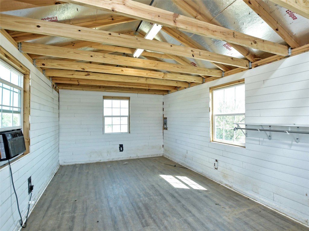 1000 County Road 484 Elgin, TX 78621 - Photo 27 of 30 a view of empty room with wooden floor and fan