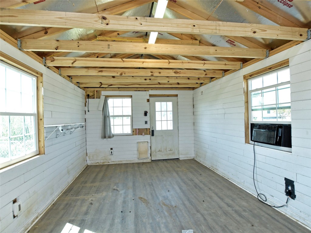 1000 County Road 484 Elgin, TX 78621 - Photo 28 of 30 a view of a livingroom with wooden floor and windows