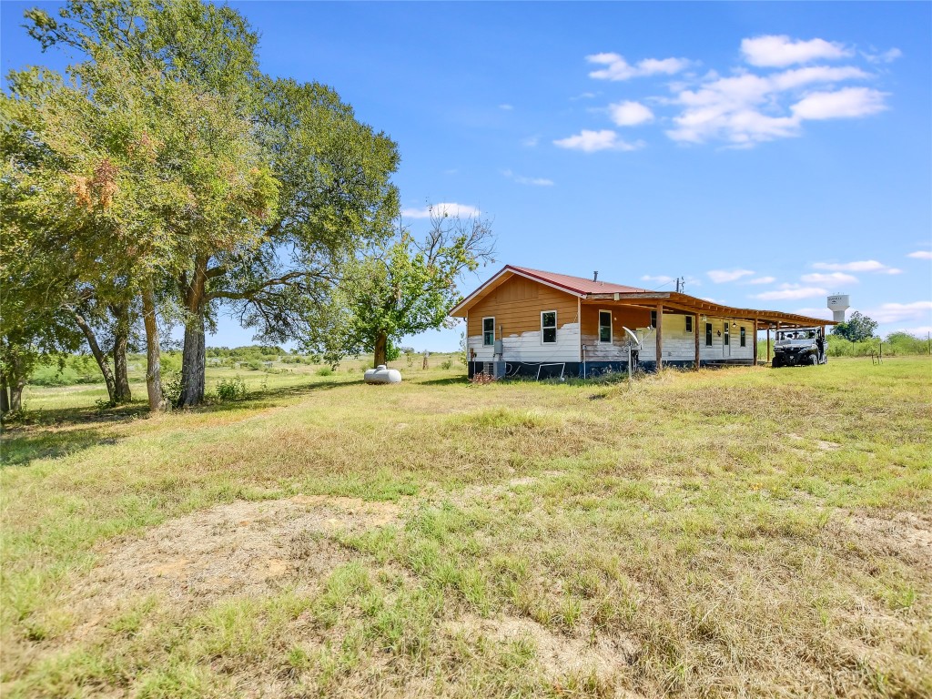 1000 County Road 484 Elgin, TX 78621 - Photo 29 of 30 a view of an house with swimming pool and outdoor space