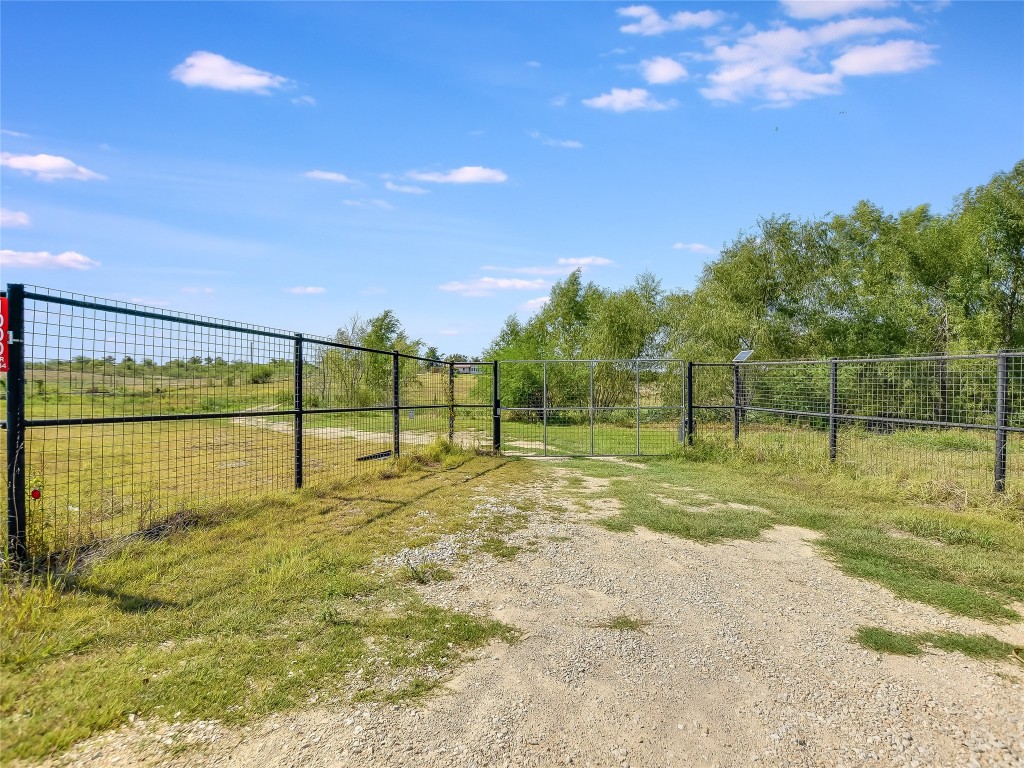 1000 County Road 484 Elgin, TX 78621 - Photo 3 of 30 a view of a yard with basketball court