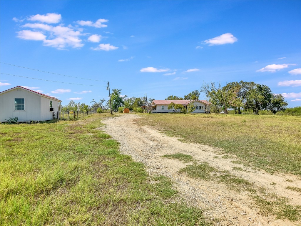 1000 County Road 484 Elgin, TX 78621 - Photo 5 of 30 a view of a lake and sunset