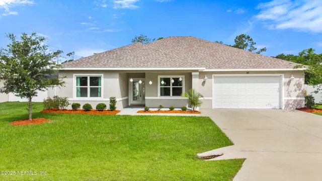 a view of a house with a yard porch and a tree