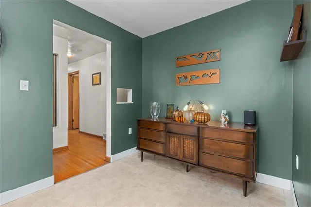 a room with furniture and mirror