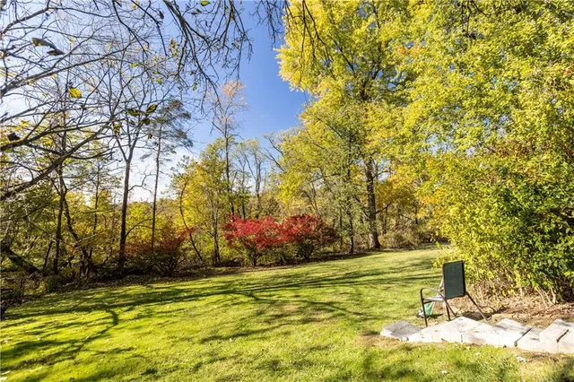 a view of swimming pool with an outdoor space and seating area