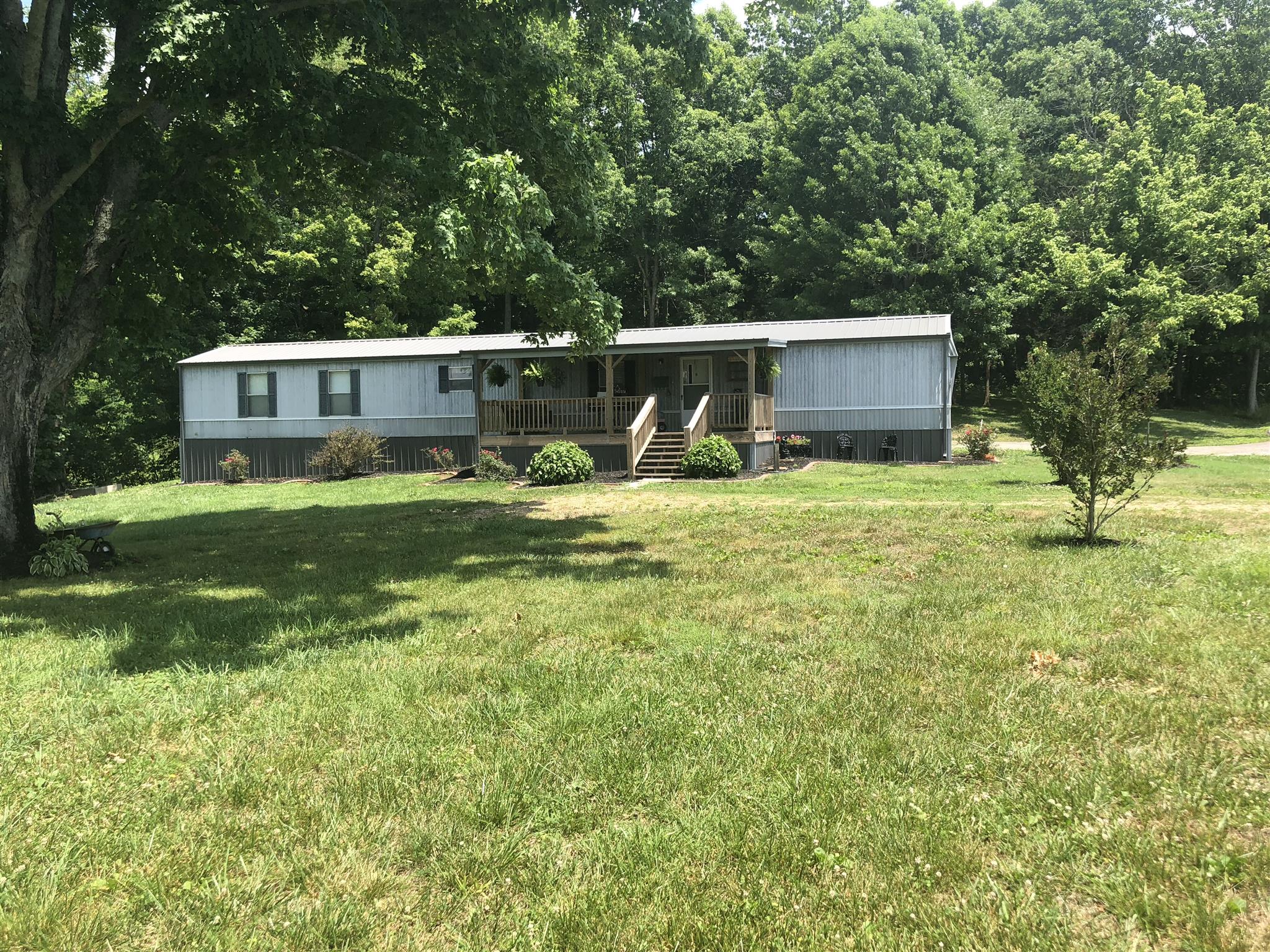 Beautiful setting!  Renovated home w/new roof,gutters, front & back decks, paint, flooring, countertops!!!  Shows great!!