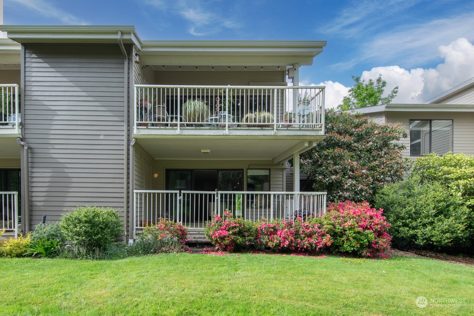 6467 Sand Point Way Northeast Seattle, WA 98115 - Photo 1 of 29 a front view of a house with a garden