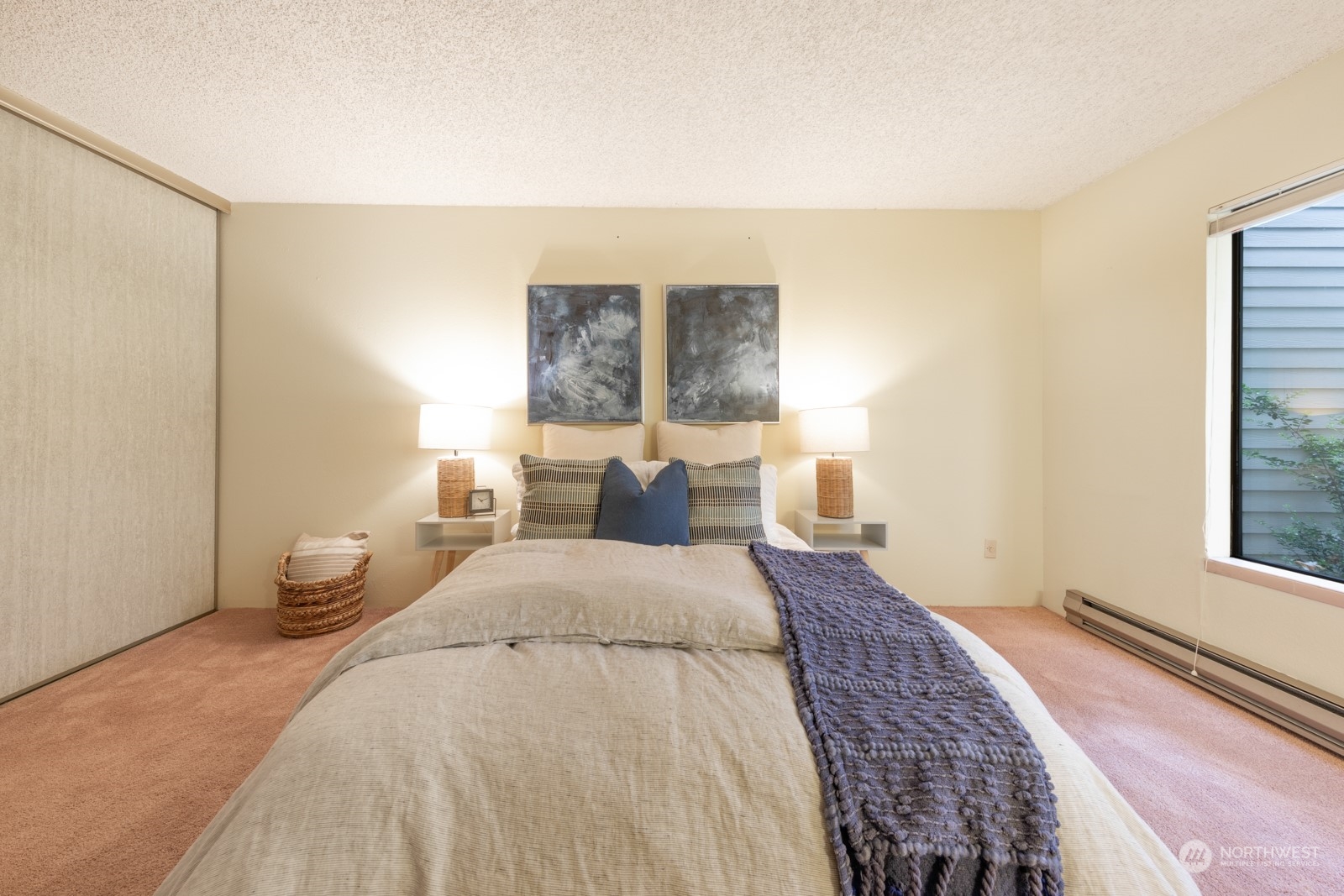 6467 Sand Point Way Northeast Seattle, WA 98115 - Photo 16 of 29 a bedroom with a bed and a window