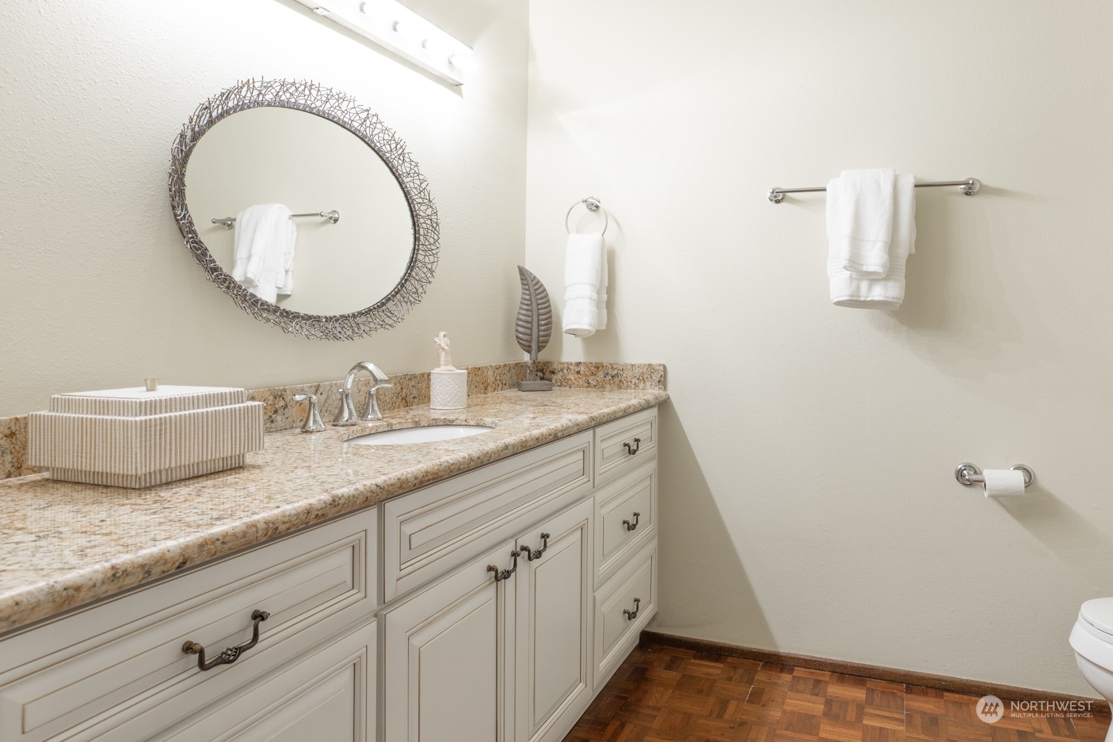 6467 Sand Point Way Northeast Seattle, WA 98115 - Photo 18 of 29 a bathroom with a granite countertop sink and a mirror