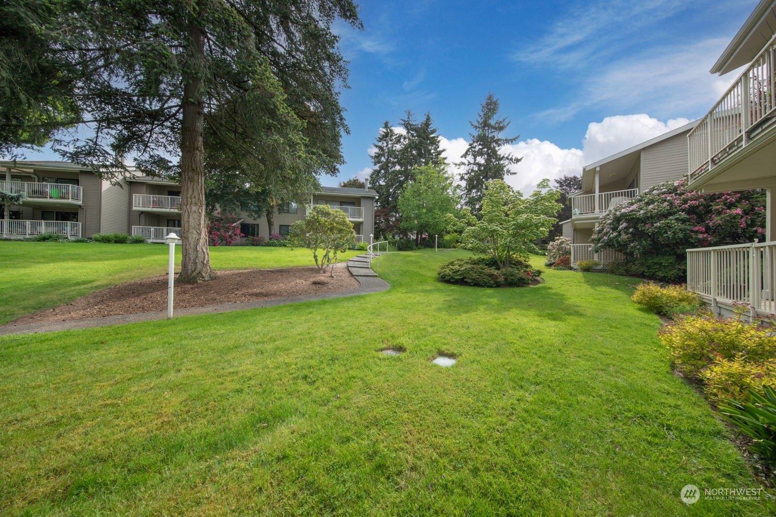 6467 Sand Point Way Northeast Seattle, WA 98115 - Photo 22 of 29 a view of a house with a yard