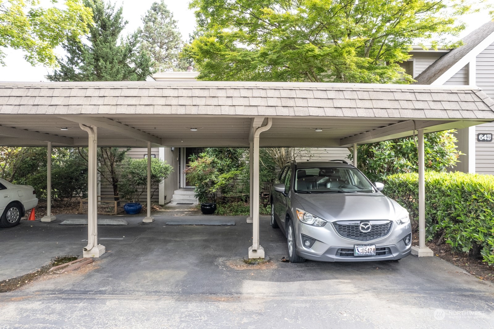 6467 Sand Point Way Northeast Seattle, WA 98115 - Photo 25 of 29 a car parked in front of a house