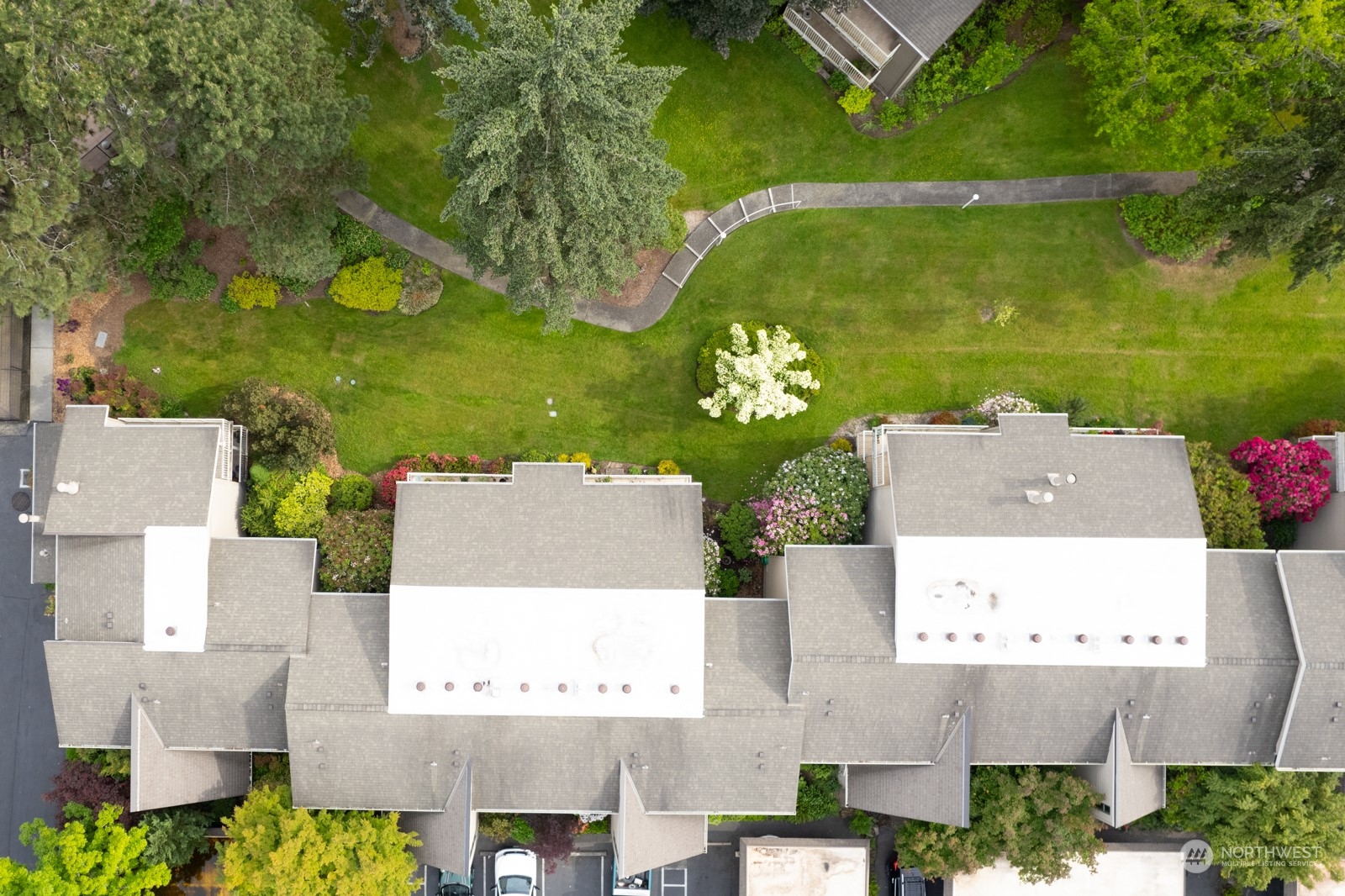 6467 Sand Point Way Northeast Seattle, WA 98115 - Photo 26 of 29 an aerial view of a house with a garden and lake view