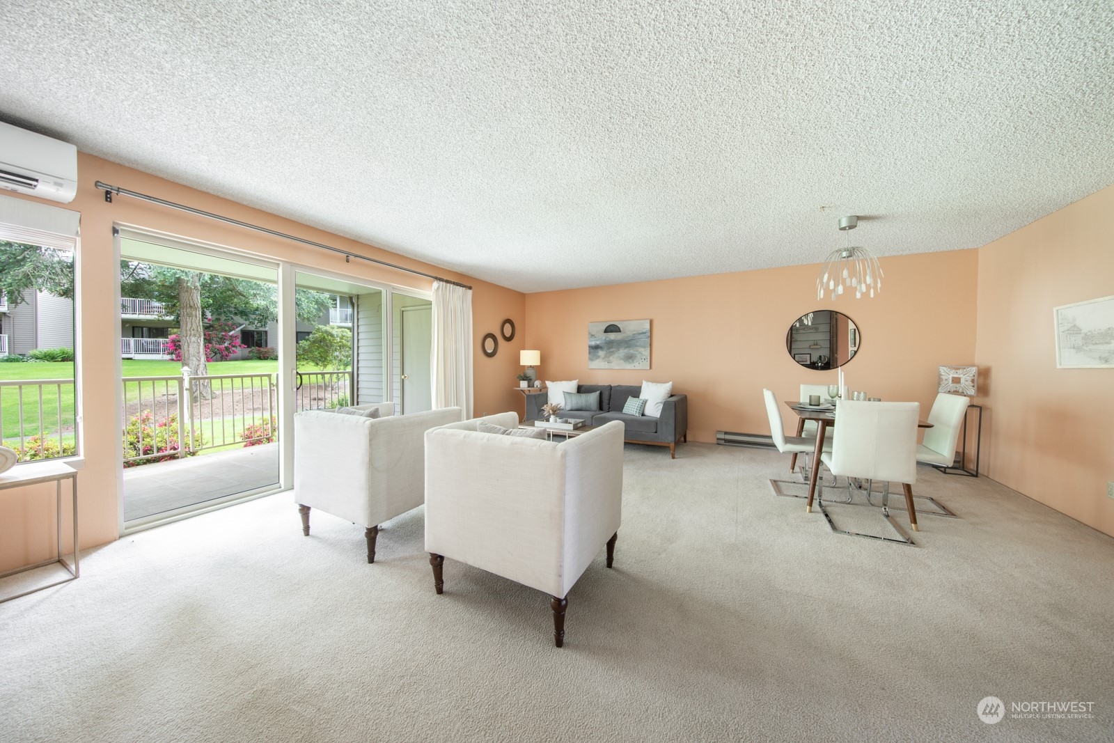 6467 Sand Point Way Northeast Seattle, WA 98115 - Photo 3 of 29 a living room with furniture and a large window