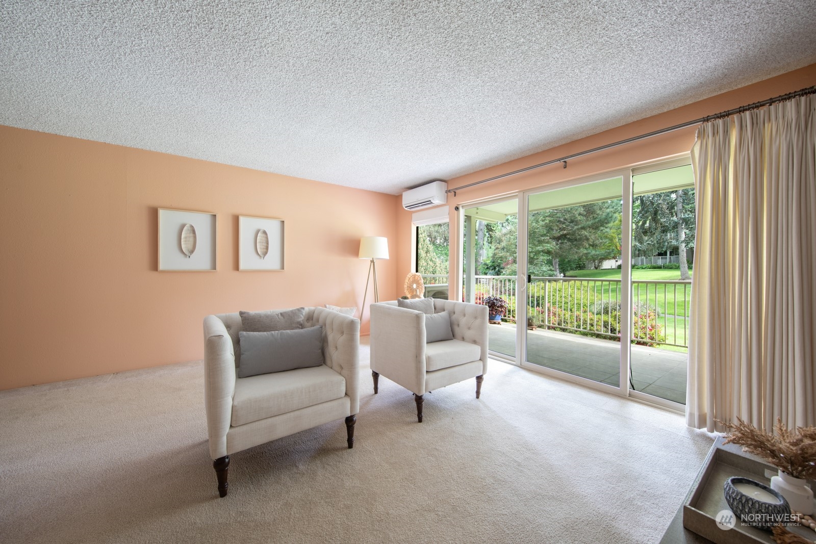 6467 Sand Point Way Northeast Seattle, WA 98115 - Photo 6 of 29 a living room with furniture and a floor to ceiling window