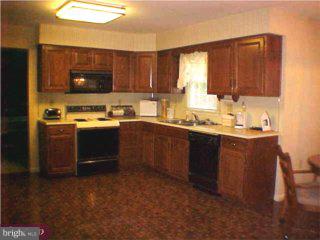 1532 Concord Road Wyomissing, PA 19610 - Photo 2 of 6 a kitchen with a sink a stove and cabinets