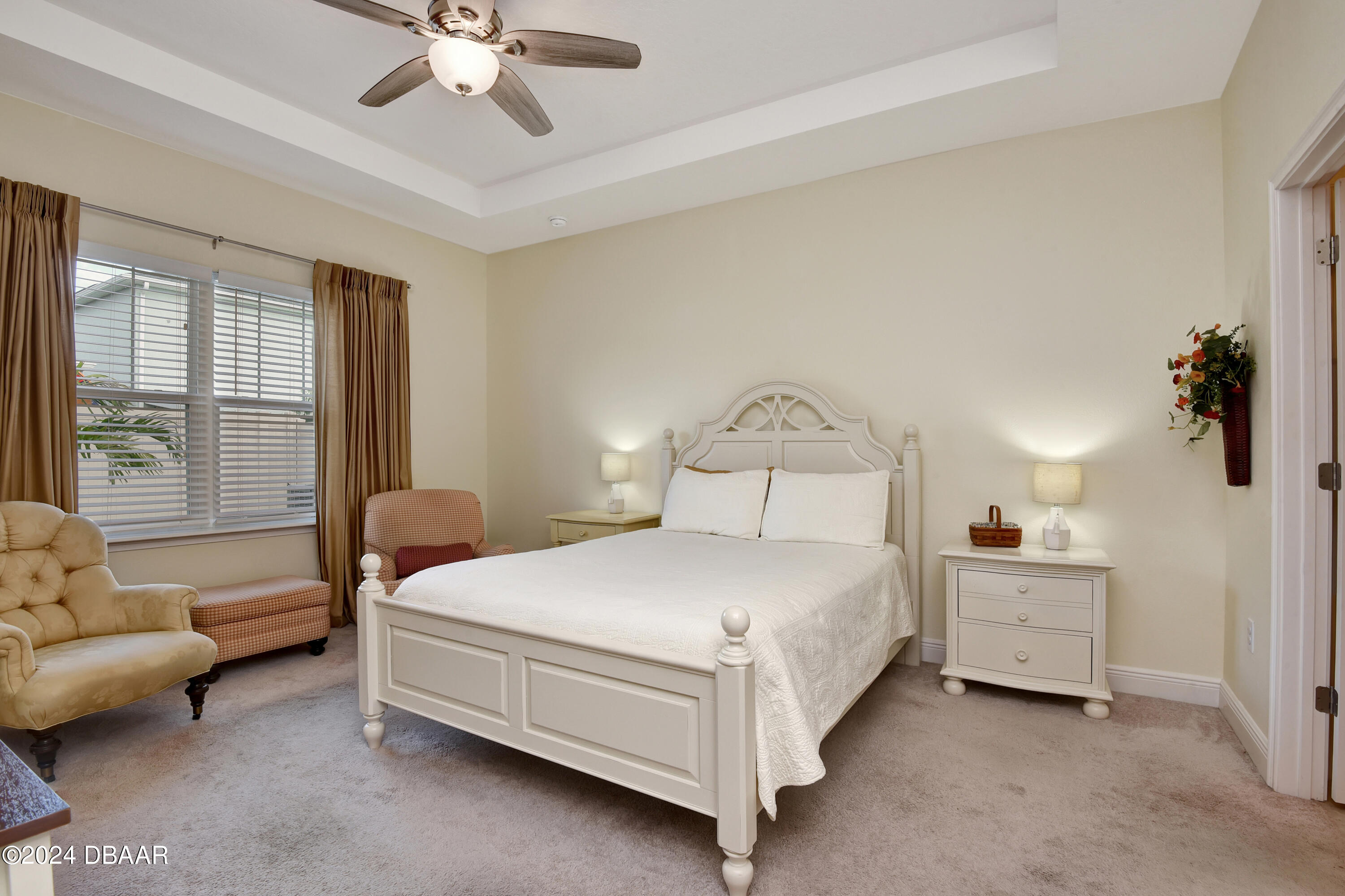 5430 Estero Loop Port Orange, FL 32128 - Photo 15 of 66 a bedroom with a bed couch and a window