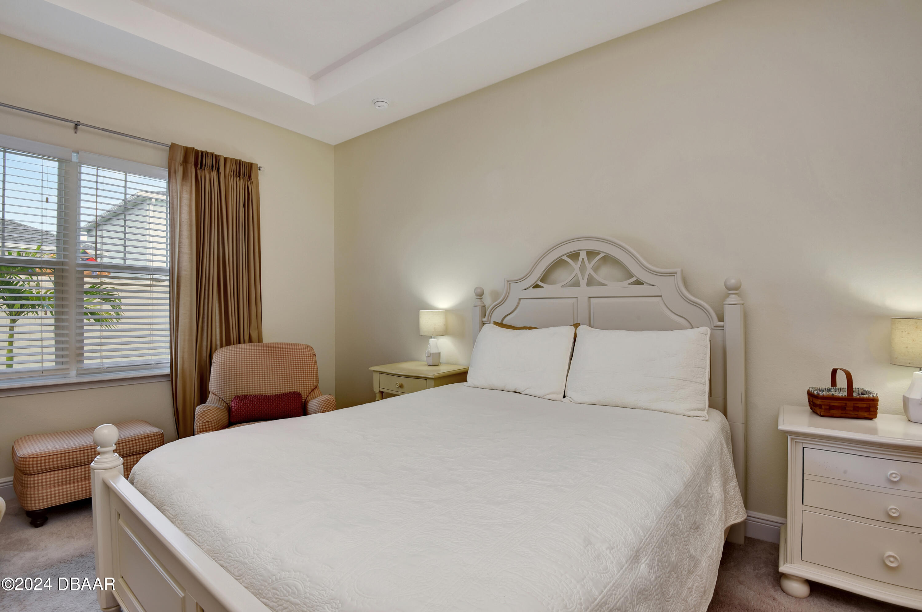 5430 Estero Loop Port Orange, FL 32128 - Photo 16 of 66 a bedroom with a bed and a chandelier