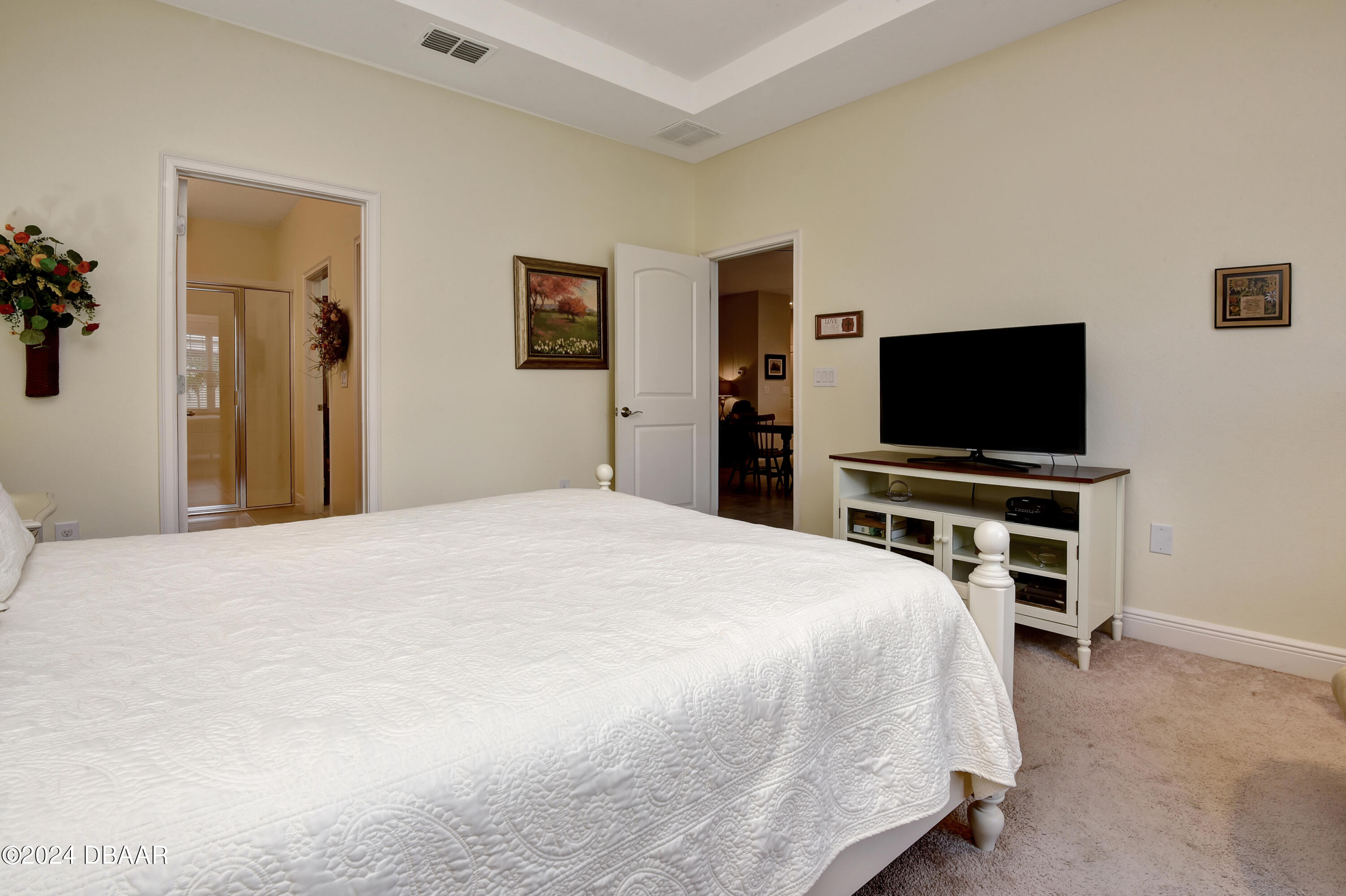 5430 Estero Loop Port Orange, FL 32128 - Photo 17 of 66 a bedroom with a bed and a flat screen tv