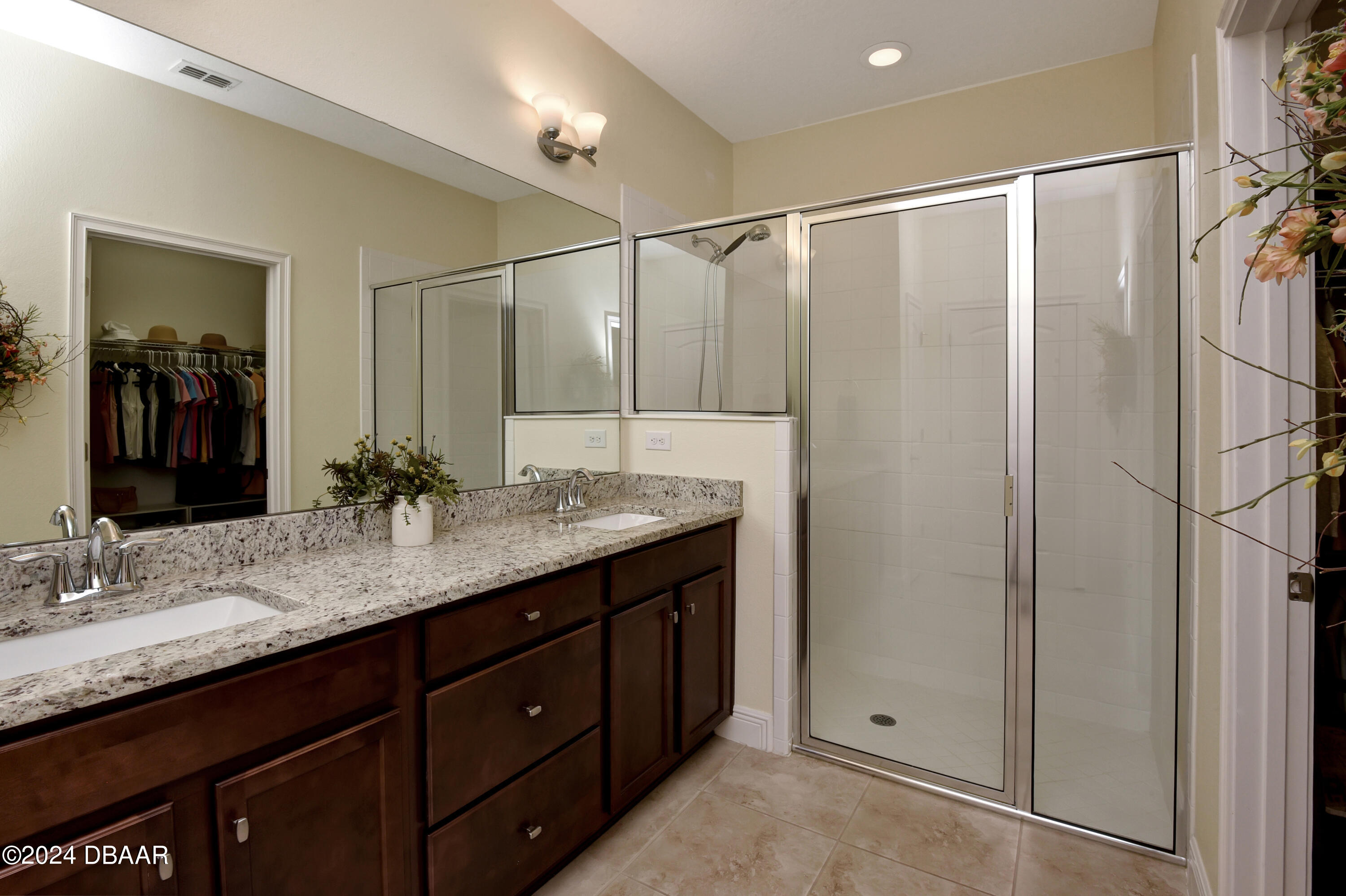 5430 Estero Loop Port Orange, FL 32128 - Photo 20 of 66 a bathroom with a granite countertop sink shower and a mirror