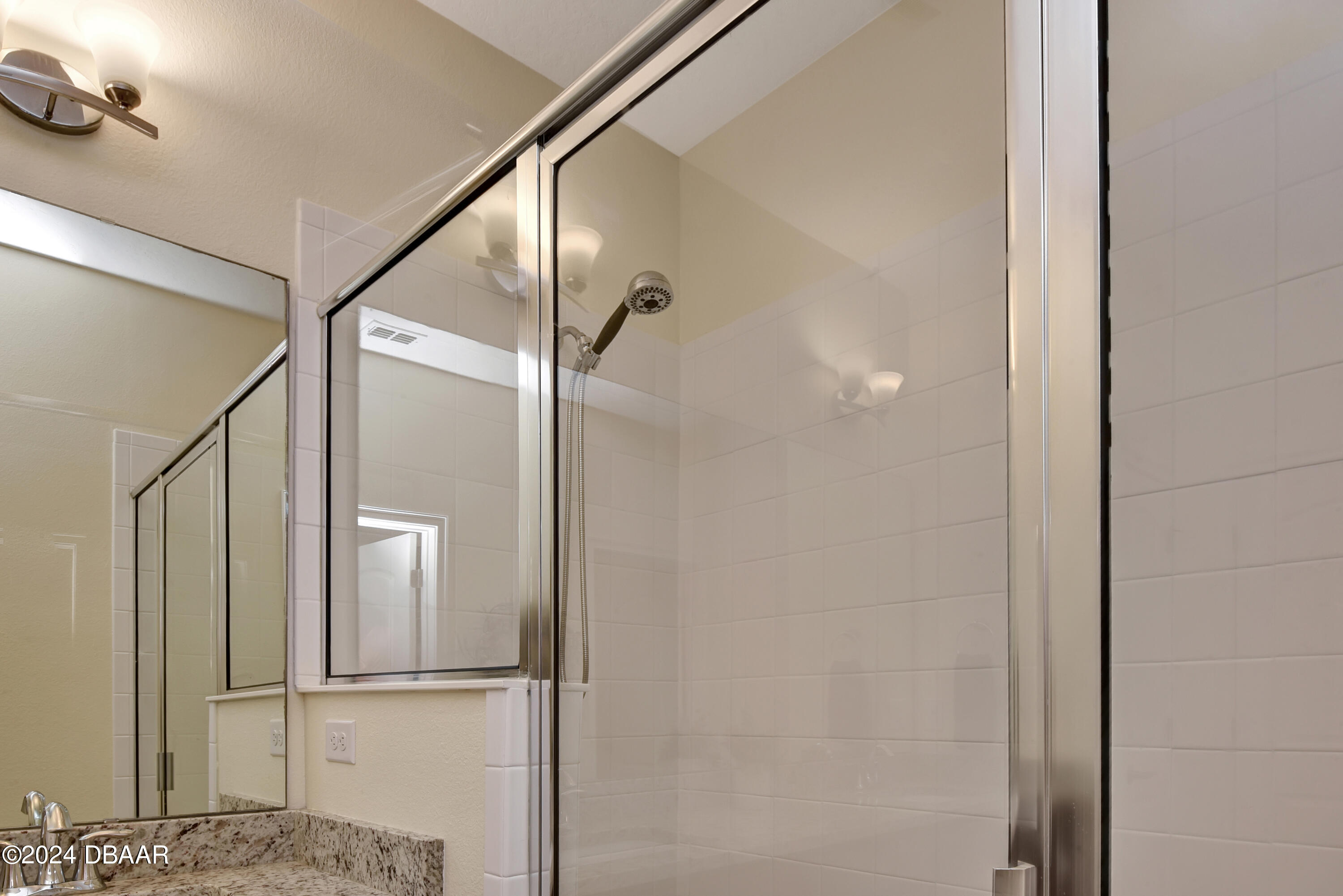 5430 Estero Loop Port Orange, FL 32128 - Photo 22 of 66 a bathroom with a glass shower door