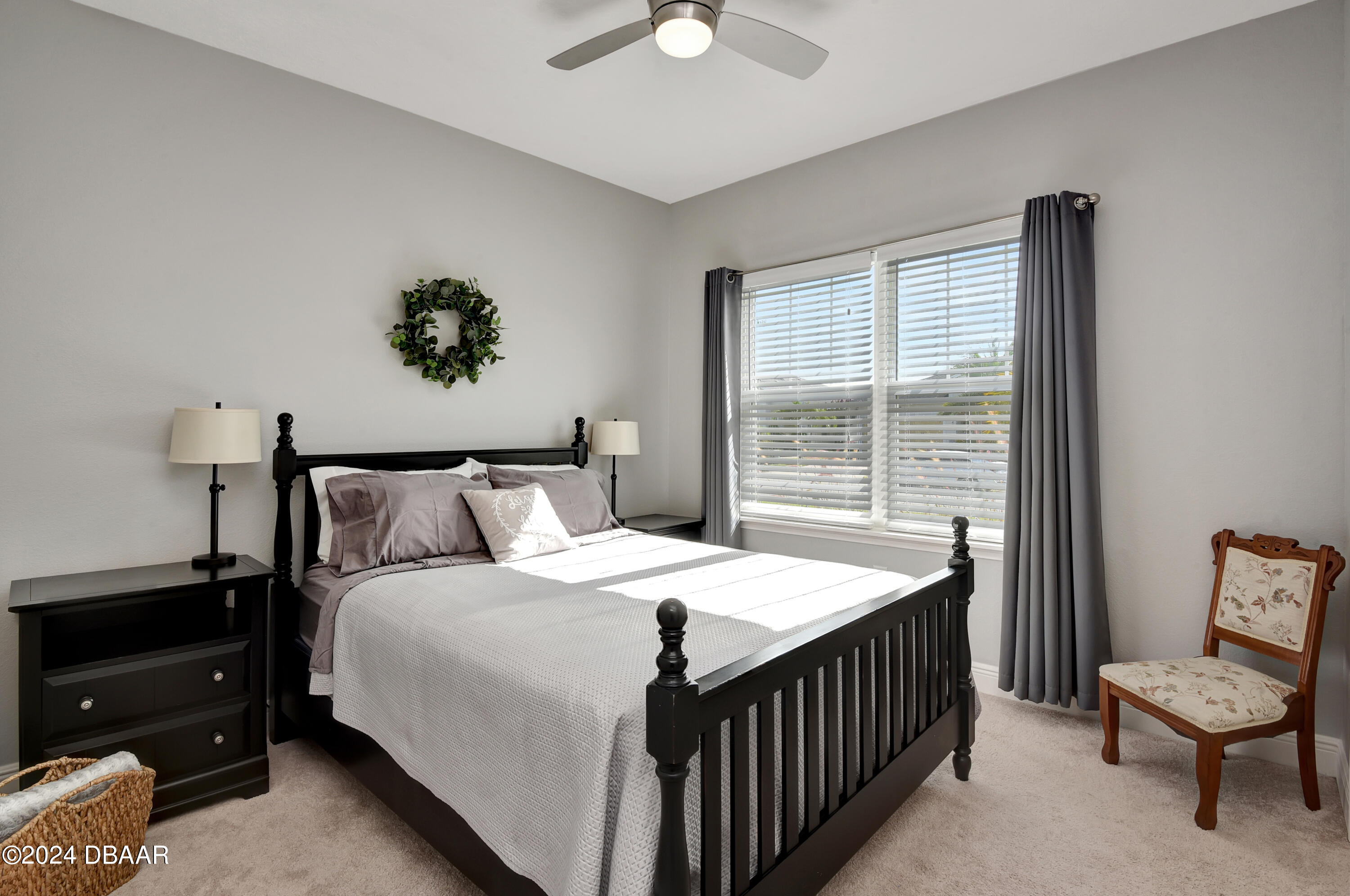 5430 Estero Loop Port Orange, FL 32128 - Photo 25 of 66 a bedroom with a bed and a chandelier