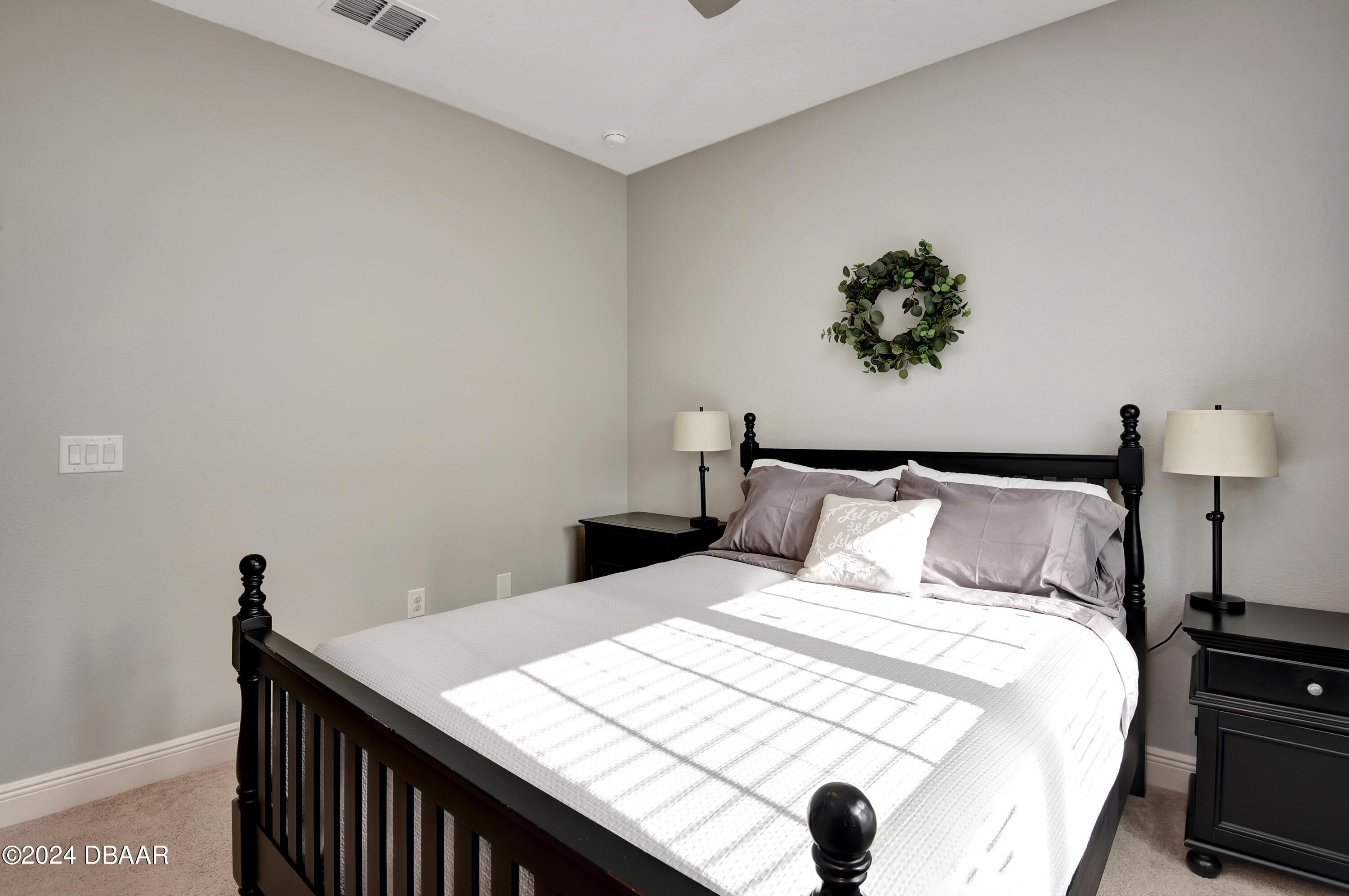 5430 Estero Loop Port Orange, FL 32128 - Photo 28 of 66 a bedroom with a bed and a table