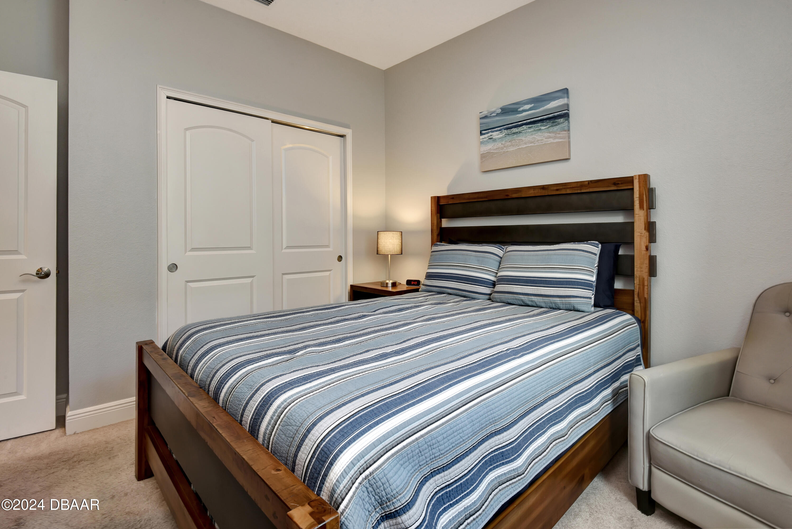 5430 Estero Loop Port Orange, FL 32128 - Photo 32 of 66 a bedroom with a bed and a chandelier