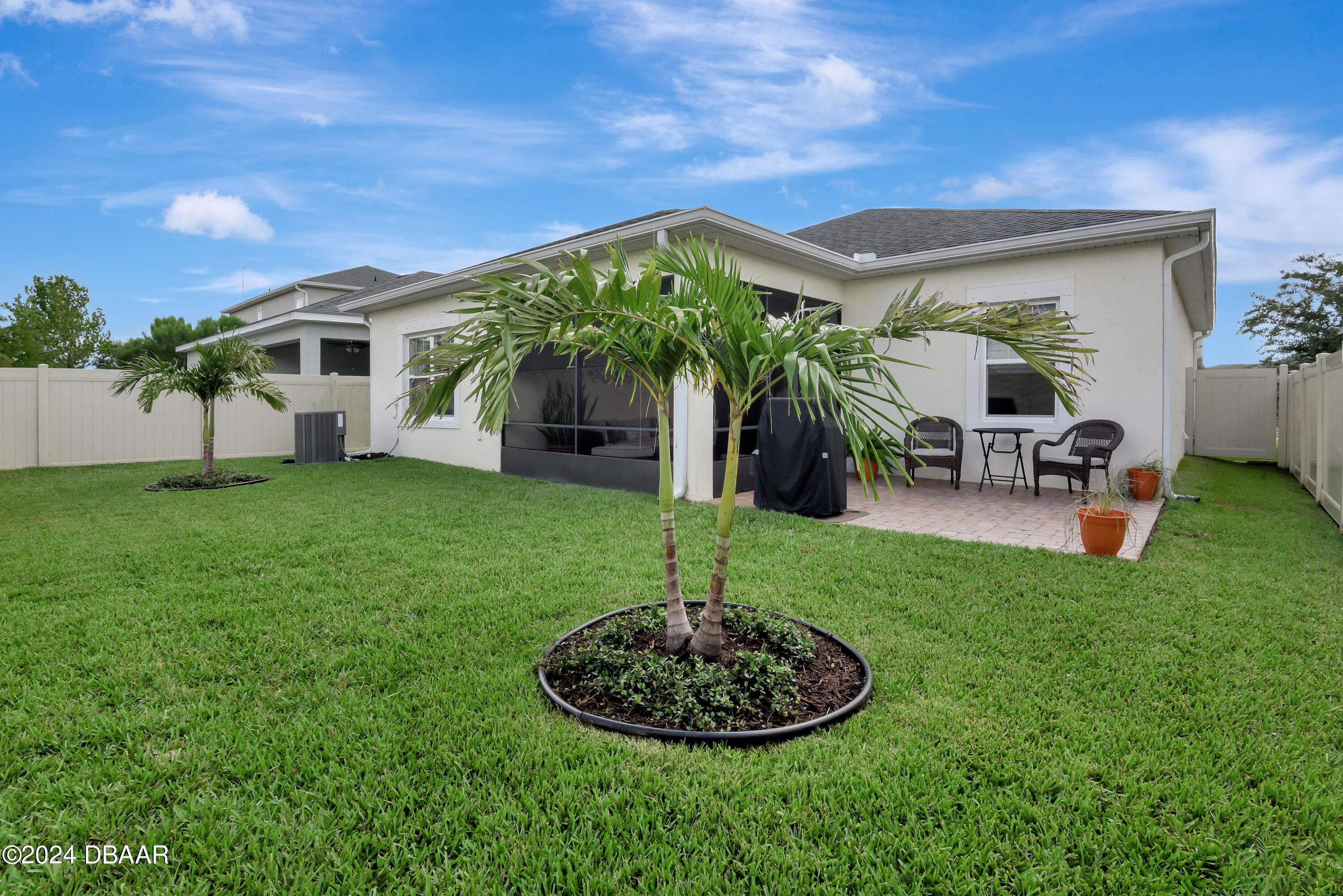 5430 Estero Loop Port Orange, FL 32128 - Photo 43 of 66 a view of a house with backyard sitting area and garden