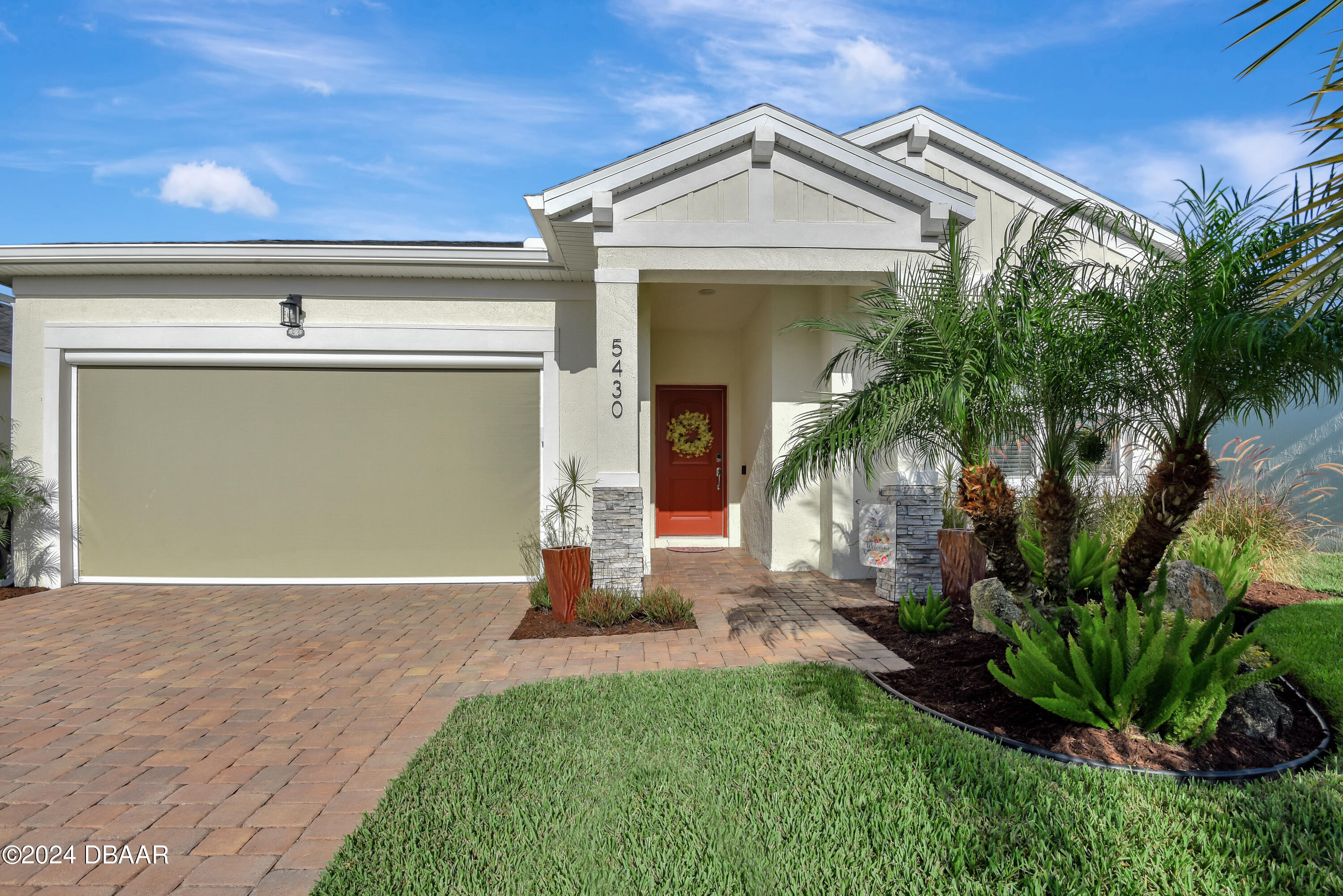 5430 Estero Loop Port Orange, FL 32128 - Photo 46 of 66 a front view of a house with a yard