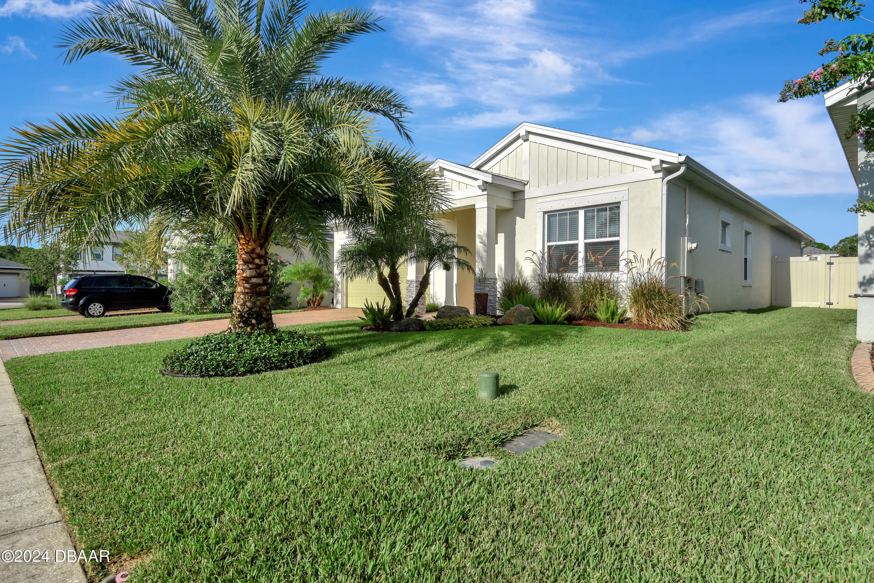 5430 Estero Loop Port Orange, FL 32128 - Photo 49 of 66 a view of a front of a house with a yard