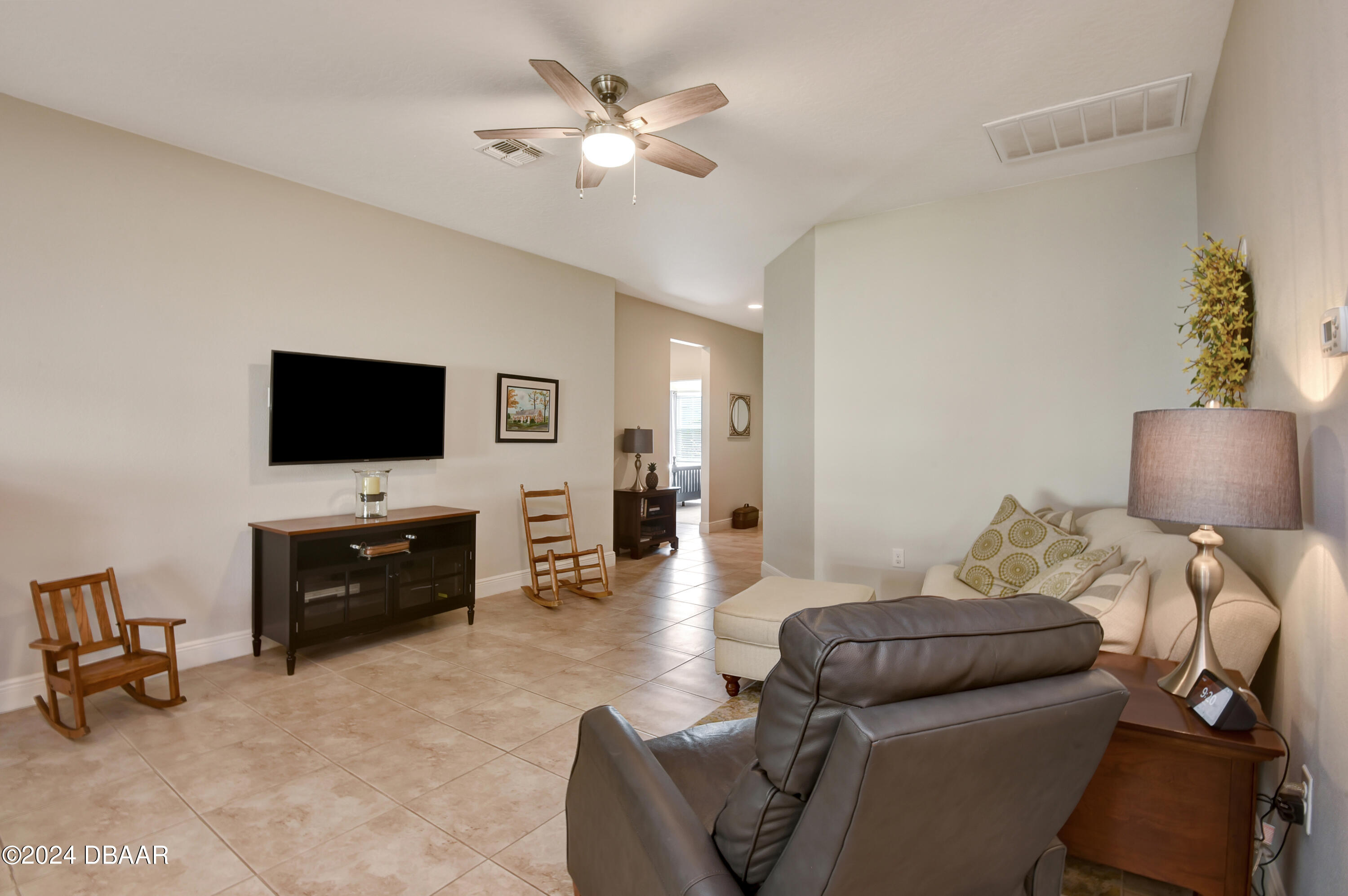5430 Estero Loop Port Orange, FL 32128 - Photo 6 of 66 a living room with furniture and a flat screen tv