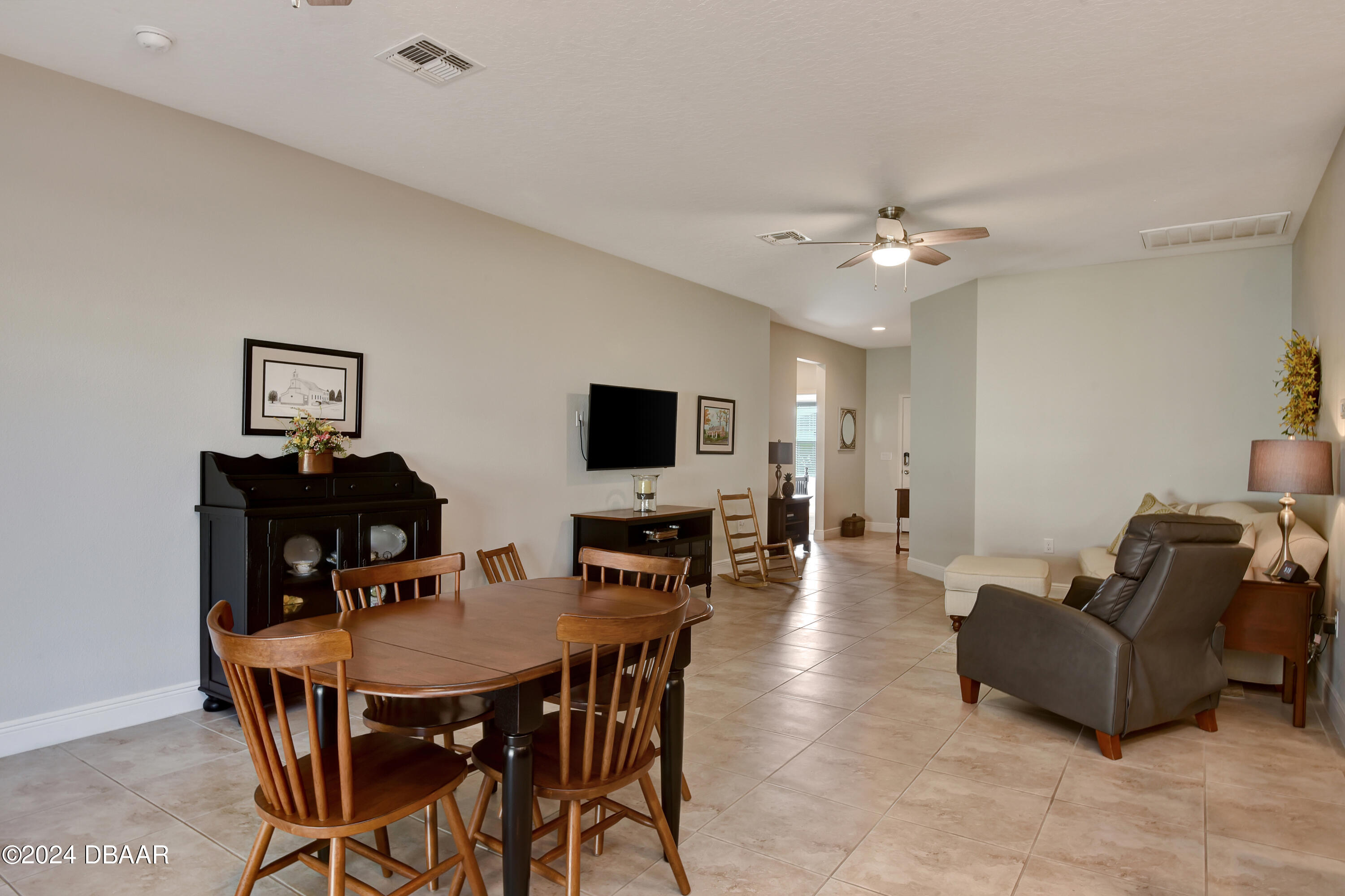 5430 Estero Loop Port Orange, FL 32128 - Photo 7 of 66 a view of a livingroom with furniture and a flat screen tv