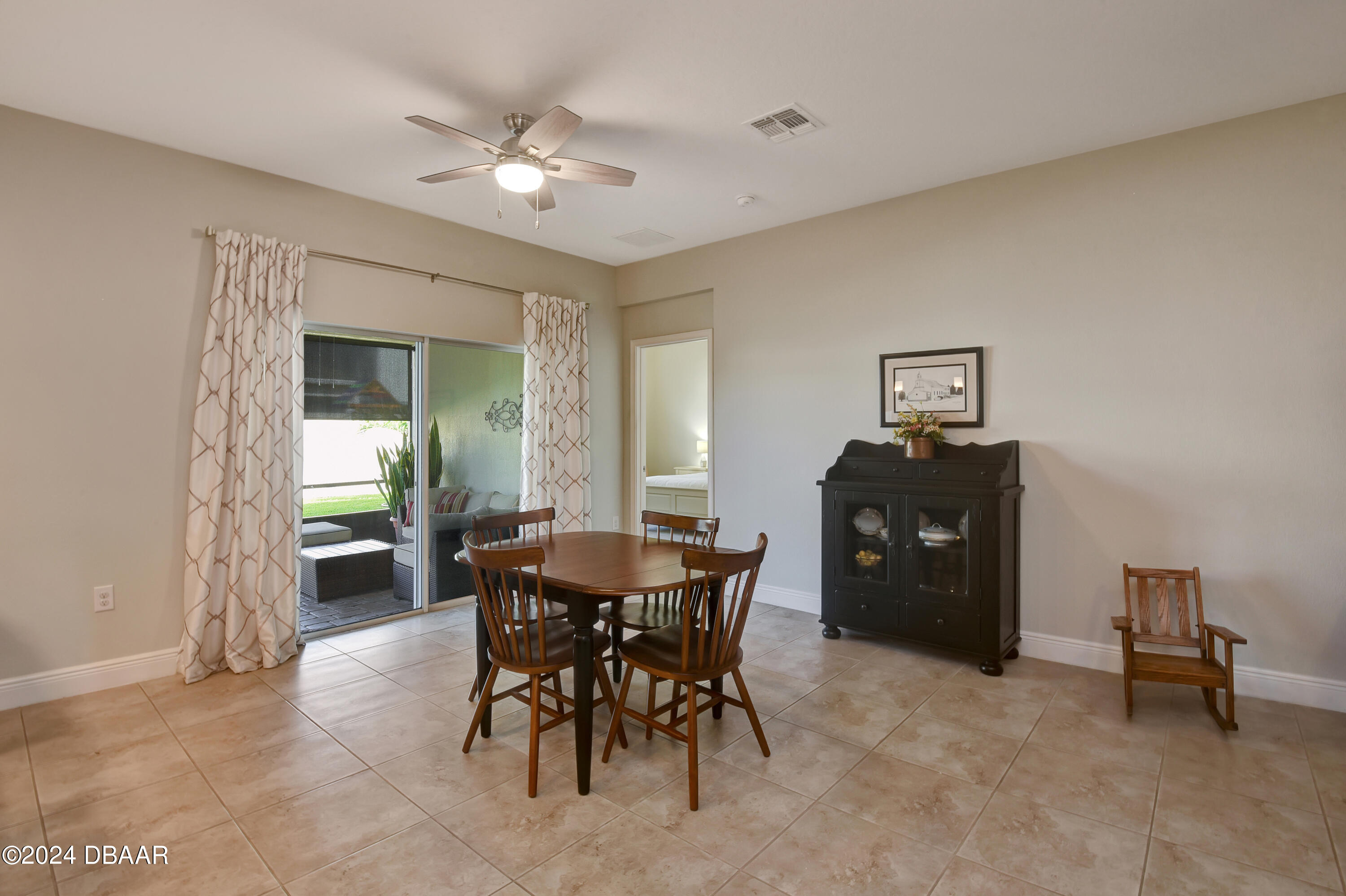 5430 Estero Loop Port Orange, FL 32128 - Photo 9 of 66 a dining room with furniture and window