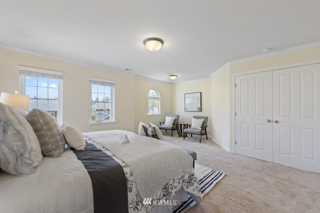 16232 Southeast 139th Court Renton, WA 98059 - Photo 12 of 23 a spacious bedroom with a bed and a window